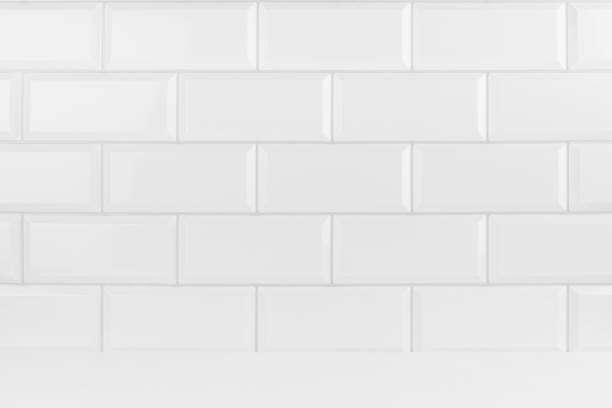 istock Abstract interior with white ceramic rectangle tiles on wall and wood floor or shelf, mockup, empty. Template for presentation, showing, design in soft light minimalistic style. 1693467610