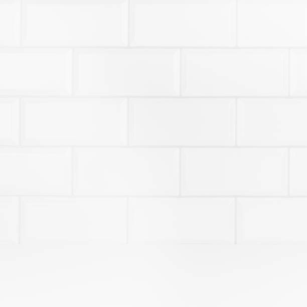 istock Soft light white abstract scene with white glossy ceramic rectangle tiles on wall, wood floor mockup. Abstract interior of bathroom, kitchen, spa salon or scene for presentation, show, design. 1693467642