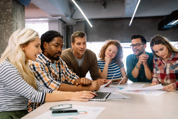 istock Business solutions, technology and strategy concept. Colleagues working and brainstorming in office 1693478135