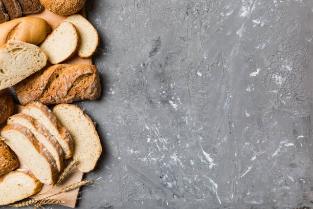 istock Homemade natural breads. Different kinds of fresh bread as background, top view with copy space 1693487200