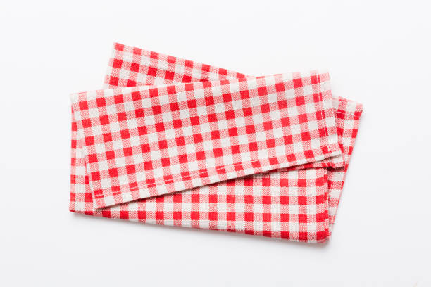 istock top view with red empty kitchen napkin isolated on table background. Folded cloth for mockup with copy space, Flat lay. Minimal style 1693487435