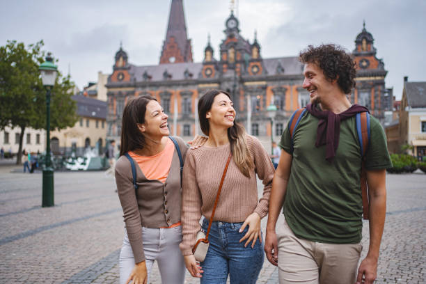 istock Three smiling tourists exploring the city of Malmo 1693493852