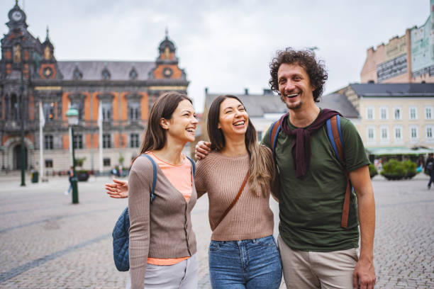 istock Three smiling tourists exploring the city of Malmo 1693493909