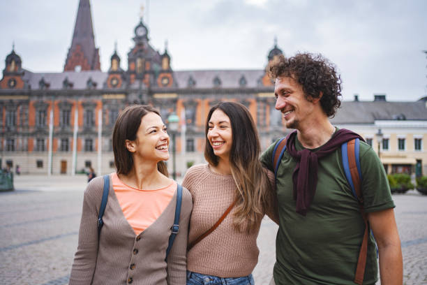 istock Three smiling tourists exploring the city of Malmo 1693493916