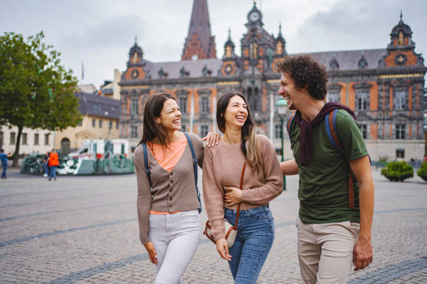 istock Three smiling tourists exploring the city of Malmo 1693493967