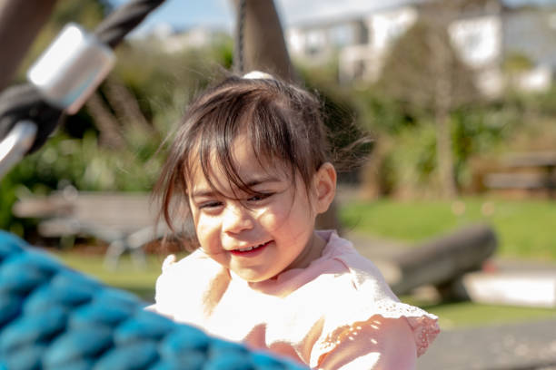 istock Baby Girl on a Swing 1693513362