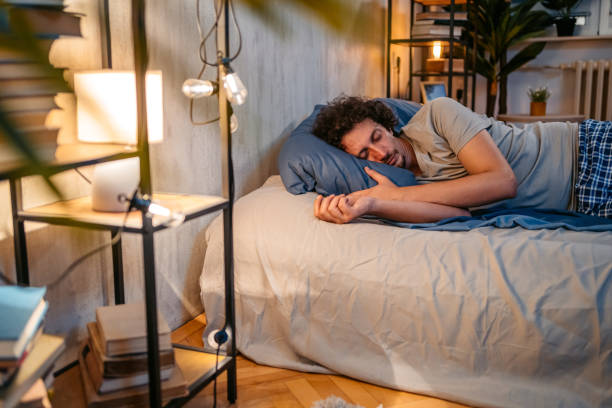 istock Young Man Sleeping In The Bed At Night 1693527889
