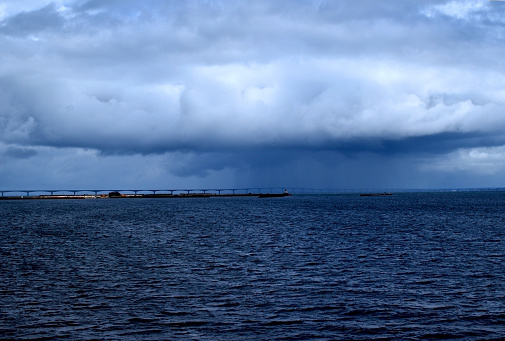 Rain Falling From Clouds on the Horizon in Summer