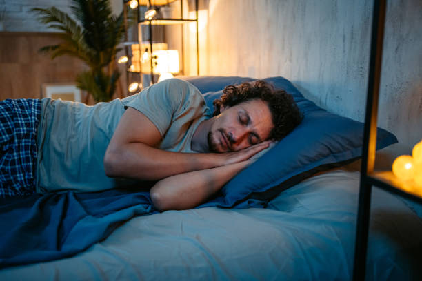 istock Young Man Sleeping In The Bed At Night 1693529569