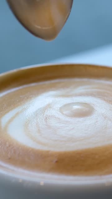 Close up barista hand making art coffee in coffee bar.