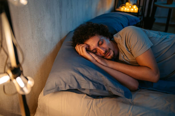 istock Young Man Sleeping In The Bed At Night 1693535936