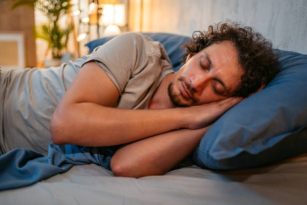 istock Young Man Sleeping In The Bed At Night 1693538300