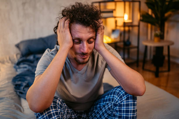 istock Young Man Having Insomnia In His Bedroom At Night 1693545838