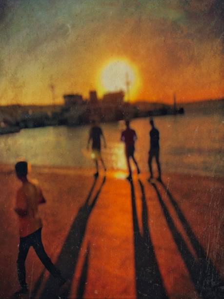 istock Silhouette people on the coast. 1693554291