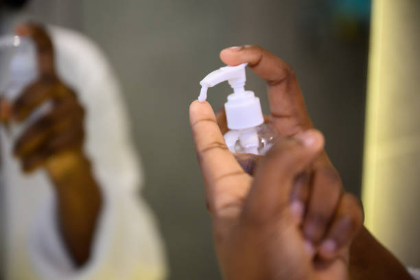 istock Close up putting moisturiser onto finger from bottle 1693572530