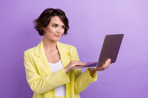 istock Photo of professional confident programmer hold laptop digital modern technology consulting worker isolated on violet color background 1693579732