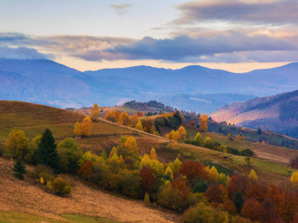 istock mountainous rural landscape at sunrise 1693580969
