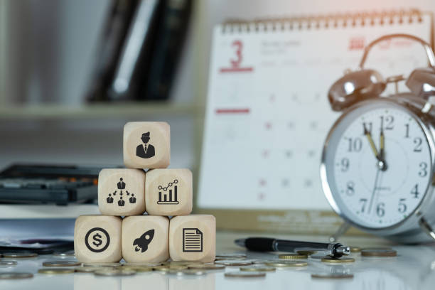 istock Icons of planning scheduleon woodblock. budget, team work, scope, risks, strategy, with gears Professional project manager presenting management skills concept. 1693586146