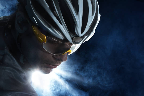istock Dramatic colorful close-up Cyclist  portrait. Sport background with copyspace. 1693595499