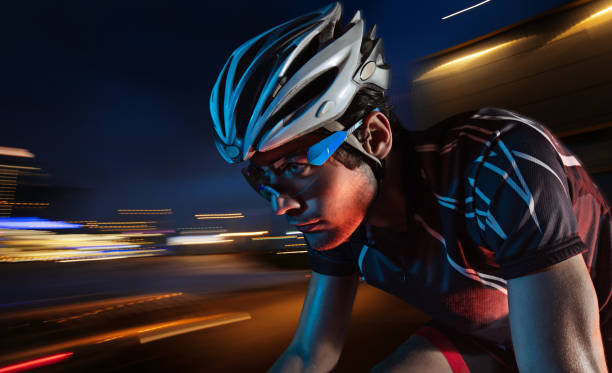 istock Dramatic colorful close-up Cyclist  portrait. Sport background with copyspace. 1693595790