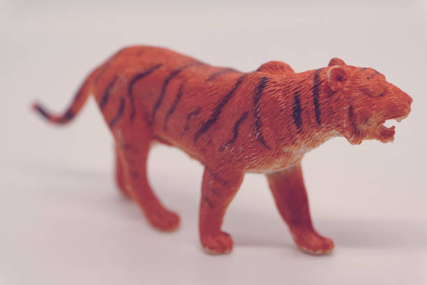 istock Tiger Plastic Toy Side View Animal Teeth Stripes Standing 1693618740
