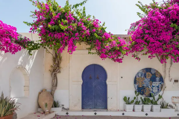 The traditional blue doors in Tunisia. This charming town Hara Sghira Er Riadh is known for its distinctive white buildings with blue accents, including doors and window frames.