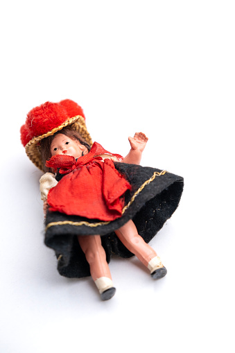 vintage, old-fashioned German doll in national dress, Abandoned, spoiled childhood, nostalgia, puppet therapy, Loss of Innocence, heal from challenging upbringing