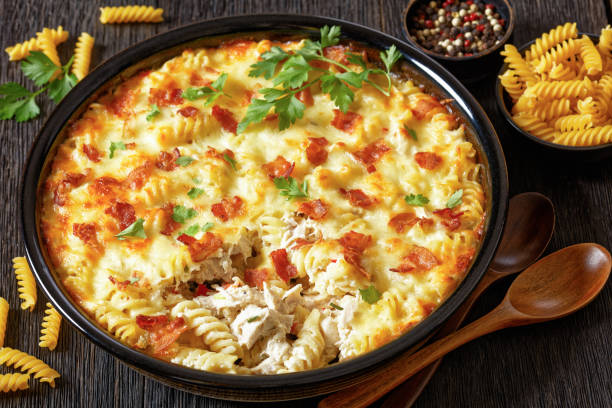 istock fusilli pasta bacon cheese chicken bake, top view 1693652334