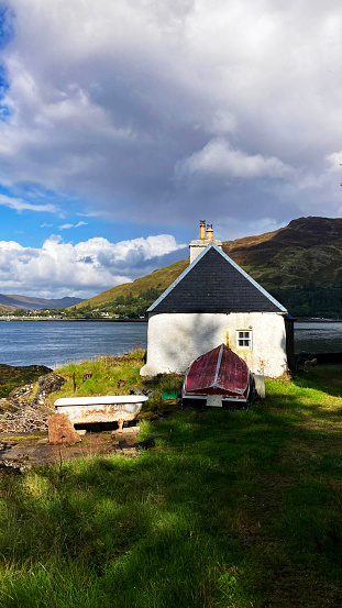Cottage with an old Bathtub overlooking Loch Duich in Scotland
