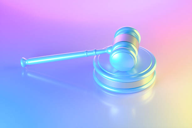 istock Gavel justice on neon lighting background blue pink and yellow colors 1693675855