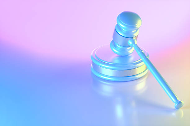 istock Gavel justice on neon lighting background blue pink and yellow colors 1693676480
