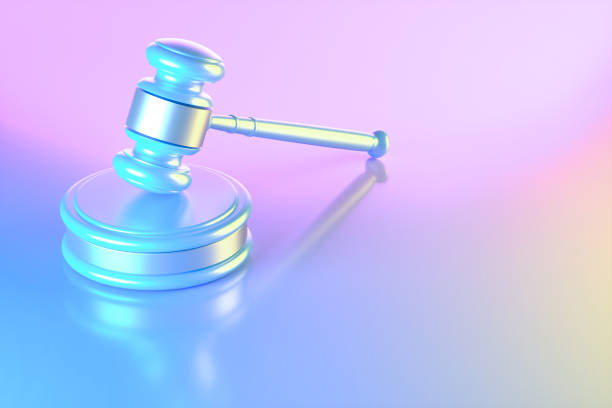 istock Gavel justice on neon lighting background blue pink and yellow colors 1693677121