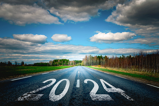 Entering the new year 2024.Start plan for 2024.The year 2024 is written on the asphalt road.Concept of business strategy,opportunity,hope and new life change.New future concept.