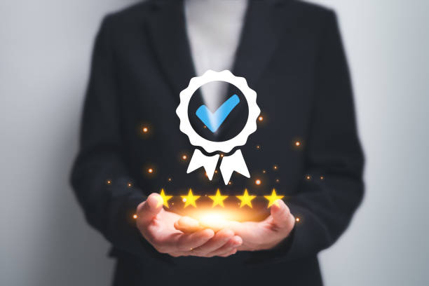 istock Quality Assurance ISO certification and standardization concept, Businesswomen show best assurance icon in hand Product satisfaction guaranteed to Develop quality to international standards 1693682317