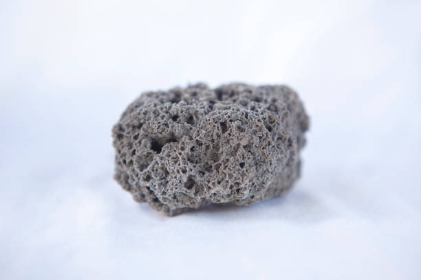istock Unpolished black pumice rock cutout 1693684656