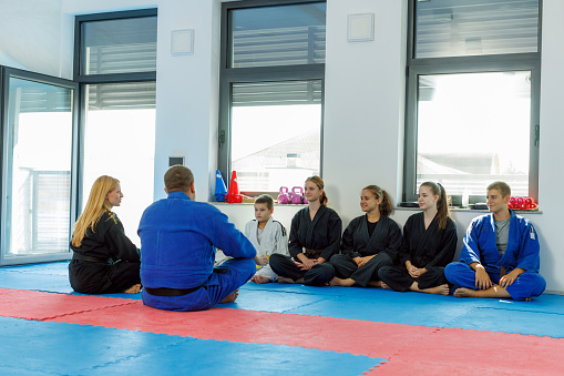 Master of real aikido talks to children during training.