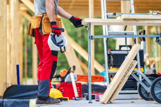 istock Construction Worker Staying Next to Wooden Skeleton Frame of a House 1693721407