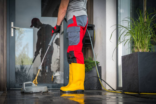 istock Cleaning His Backyard Garden Patio Using High Pressure Washer 1693724314