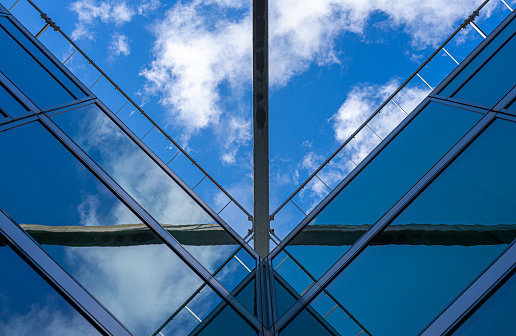Germany, Berlin, September 19, 2023  -Low angle view of modern glass building against sky, berlin Zehlendorf