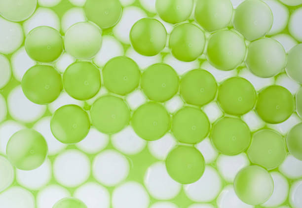 Light green cosmetic pearl ingredient molecular ball bubble textured background