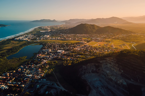 Campeche town with quarry, mountains, ocean and sunset lights in Florianopolis