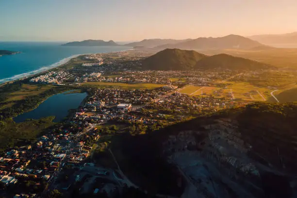 Campeche town with quarry, mountains, ocean and sunset lights in Florianopolis