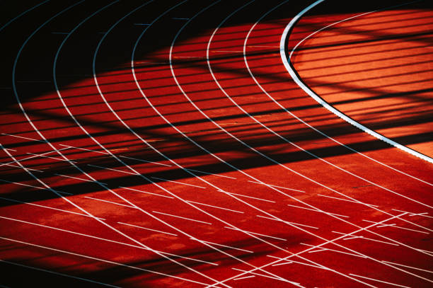istock Track and Field Wallpaper. Red Track and Shadows. 1693752427