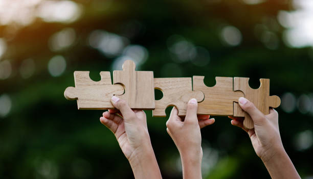 istock Jigsaw Puzzle Pieces Important Components Good work energy, connection, communication. and perfection, teamwork concept 1693753701