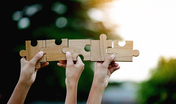 istock Jigsaw Puzzle Pieces Important Components Good work energy, connection, communication. and perfection, teamwork concept 1693753704