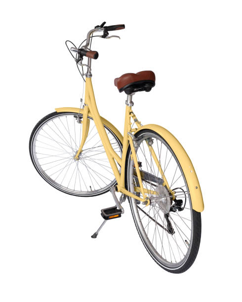 Yellow retro bicycle with brown saddle and handles, generic bike back view stock photo