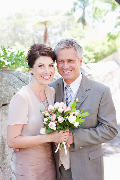 istock Mature bride and groom smiling 169376992