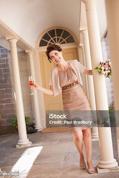 Mature Bride Holding Bouquet Stock Photo - Download Image Now - Bridesmaid, Wedding, 30-39 Years