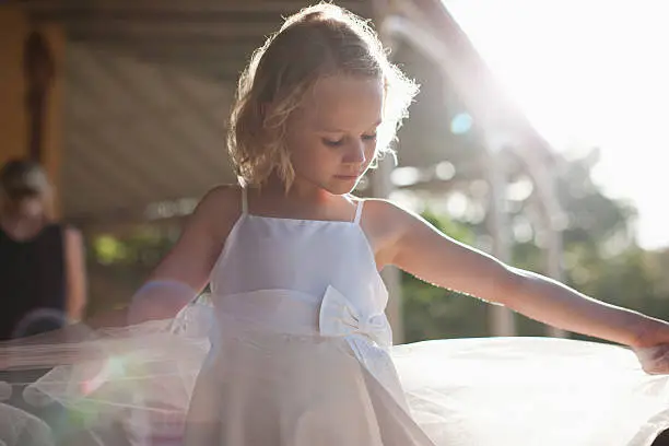 Photo of Flower girl with arms outstretched