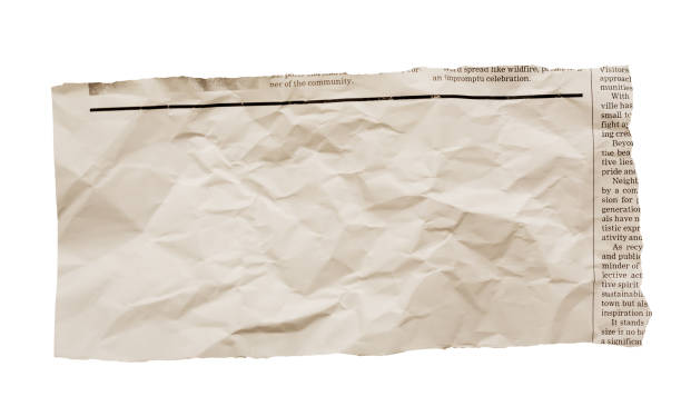 istock Wrinkled newspaper clipping with blank space for your copy 1693796503